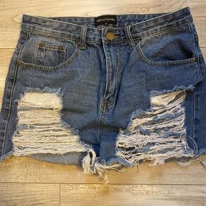 Torn jean shorts